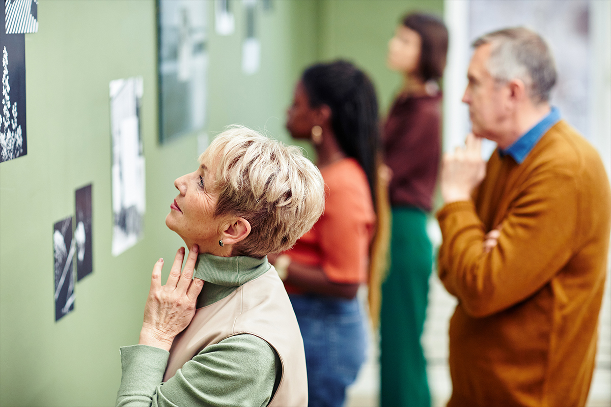 senior at an art exhibit