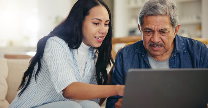 senior father and daughter on the computer