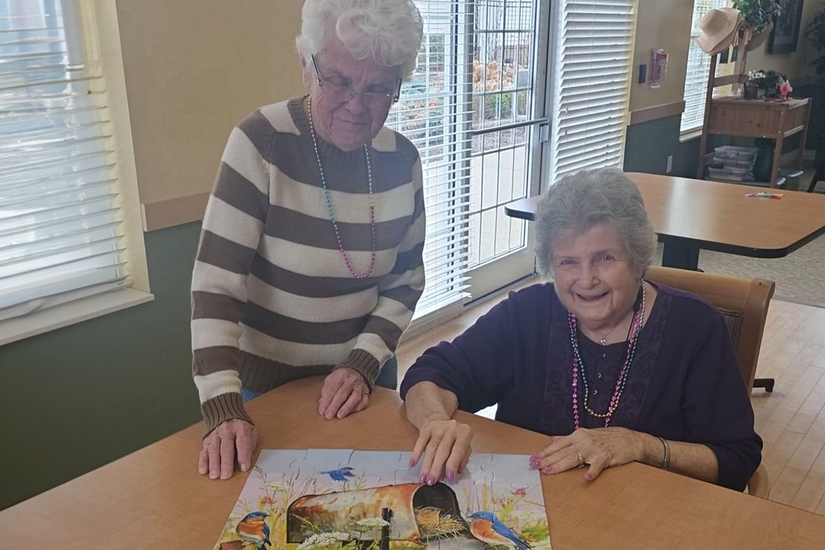 Danbury Wooster Residents working on a puzzle