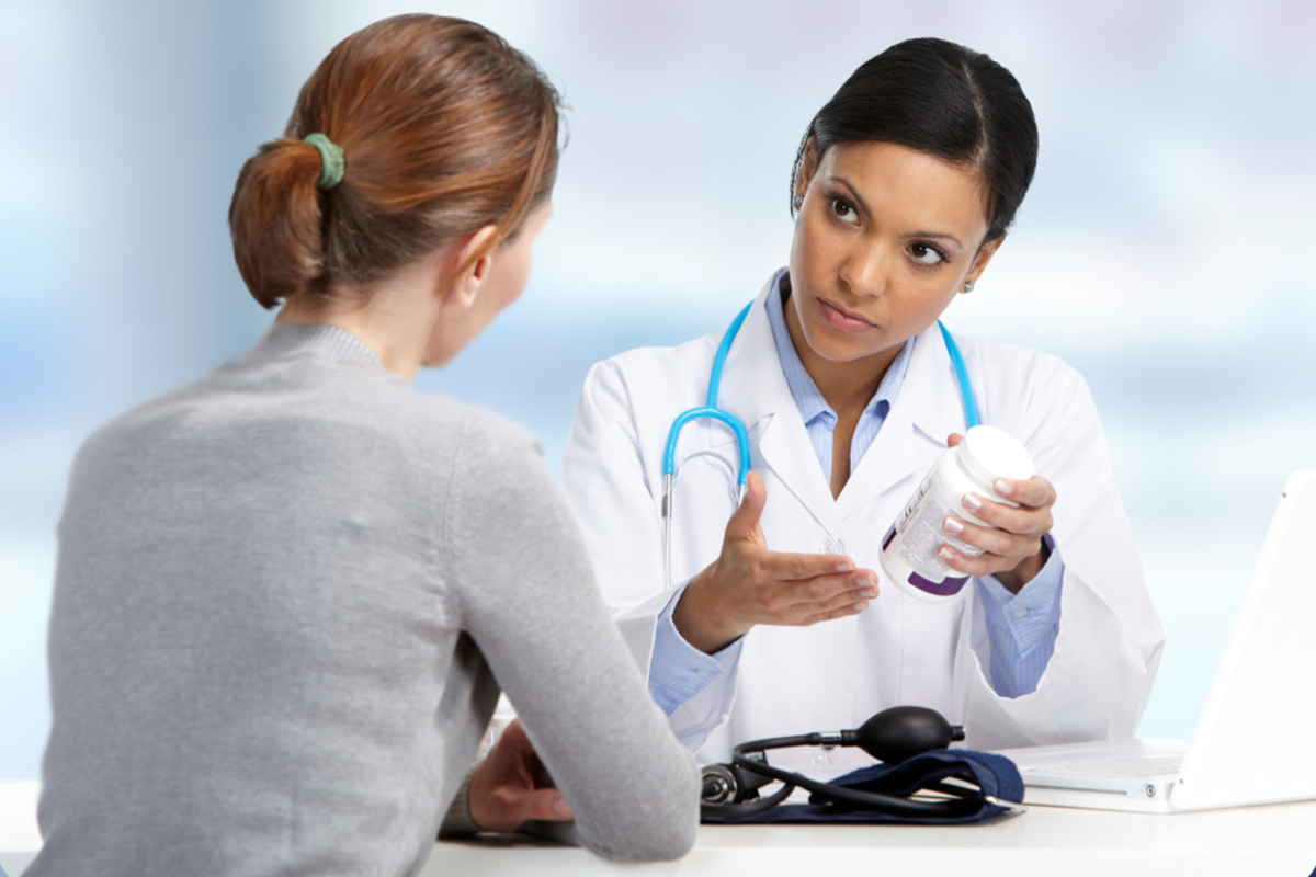 A doctor and patient discussing a prescription medication.