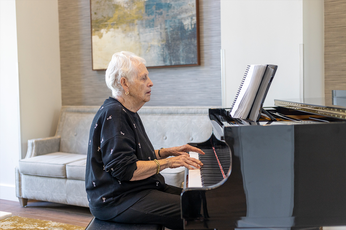 storypoint resident playing the piano