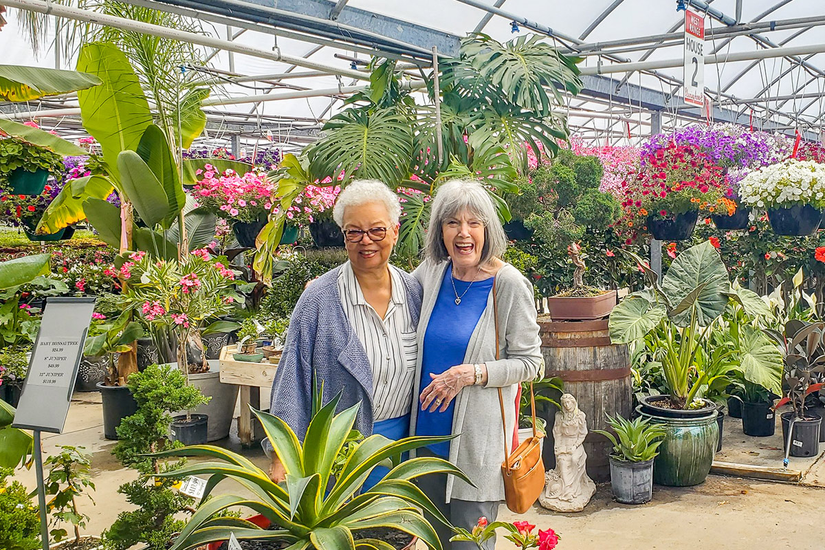 StoryPoint Group Residents enjoying a greenhouse. 