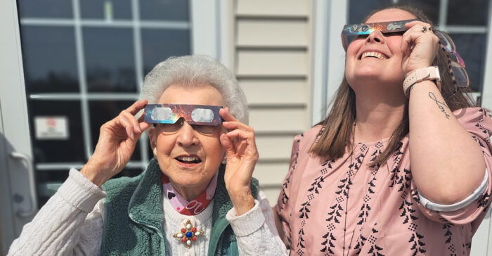 StoryPoint Group resident looking at the 2024 solar eclipse