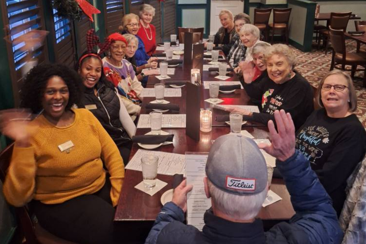 Group of seniors from StoryPoint Cordova out to dinner at a restaurant