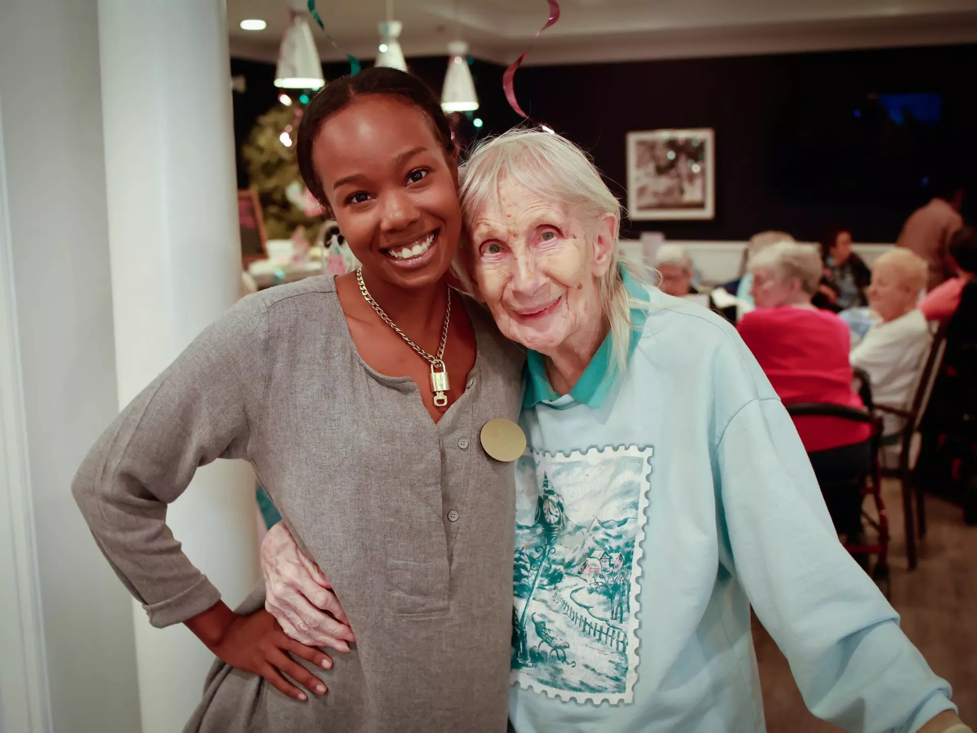 Community director and resident hugging