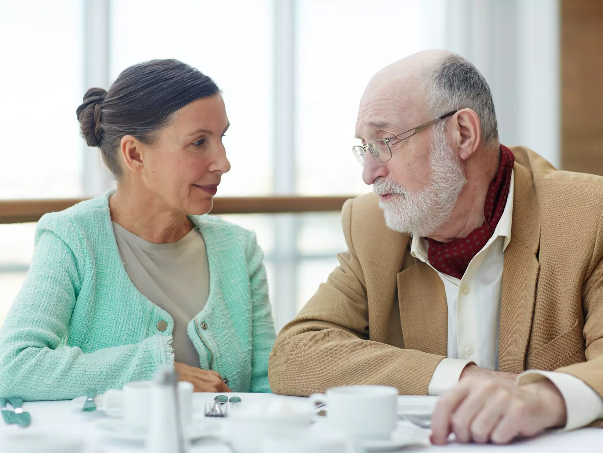 women and senior talking