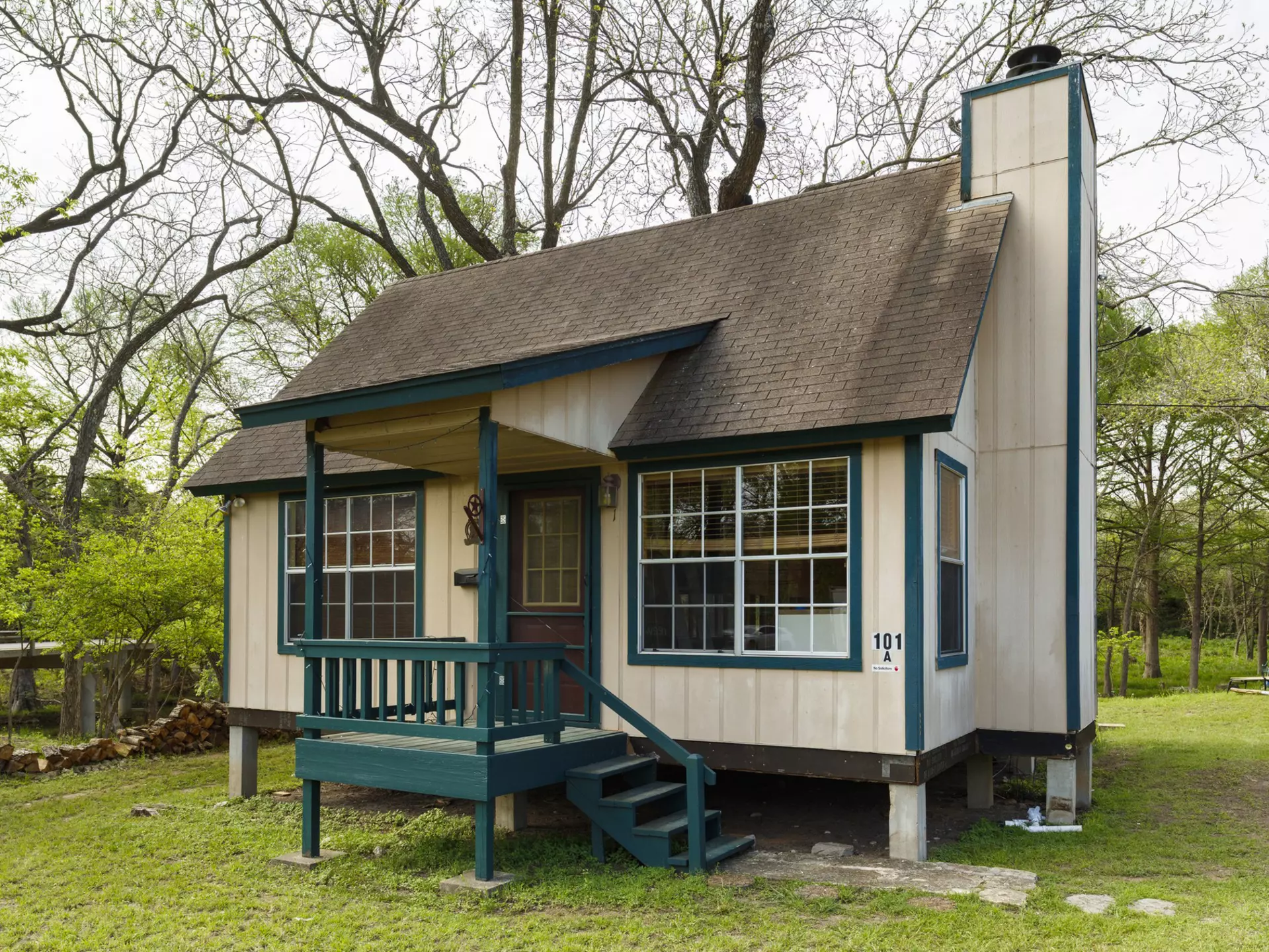 A beige and green tiny home.