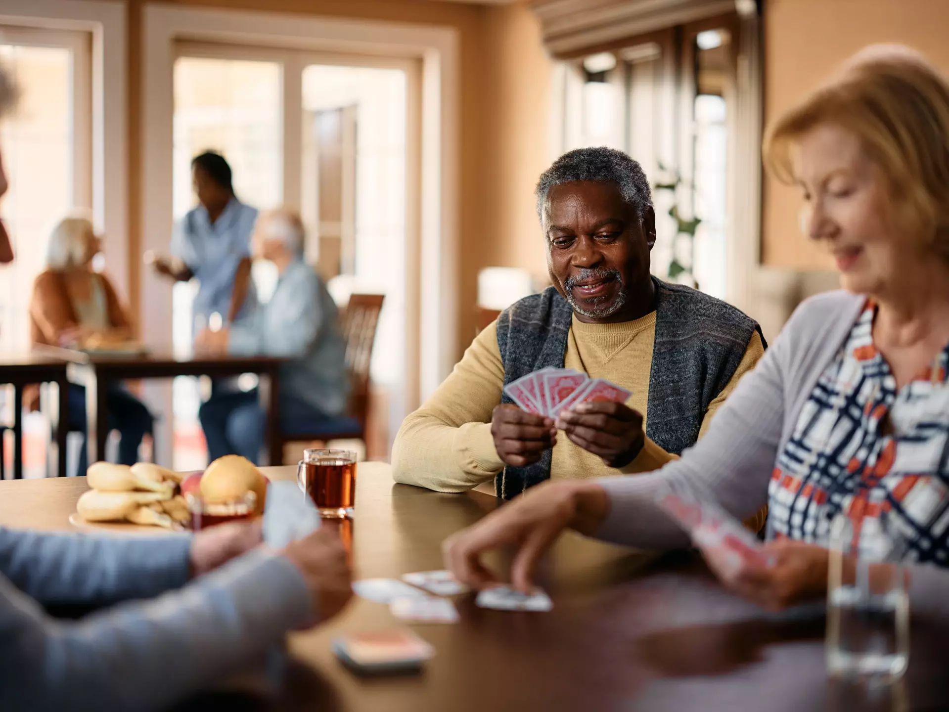 A group of seniors playing cards together.